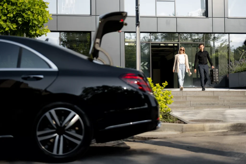London sightseeing chauffeur driving clients past iconic city landmarks in a luxury vehicle